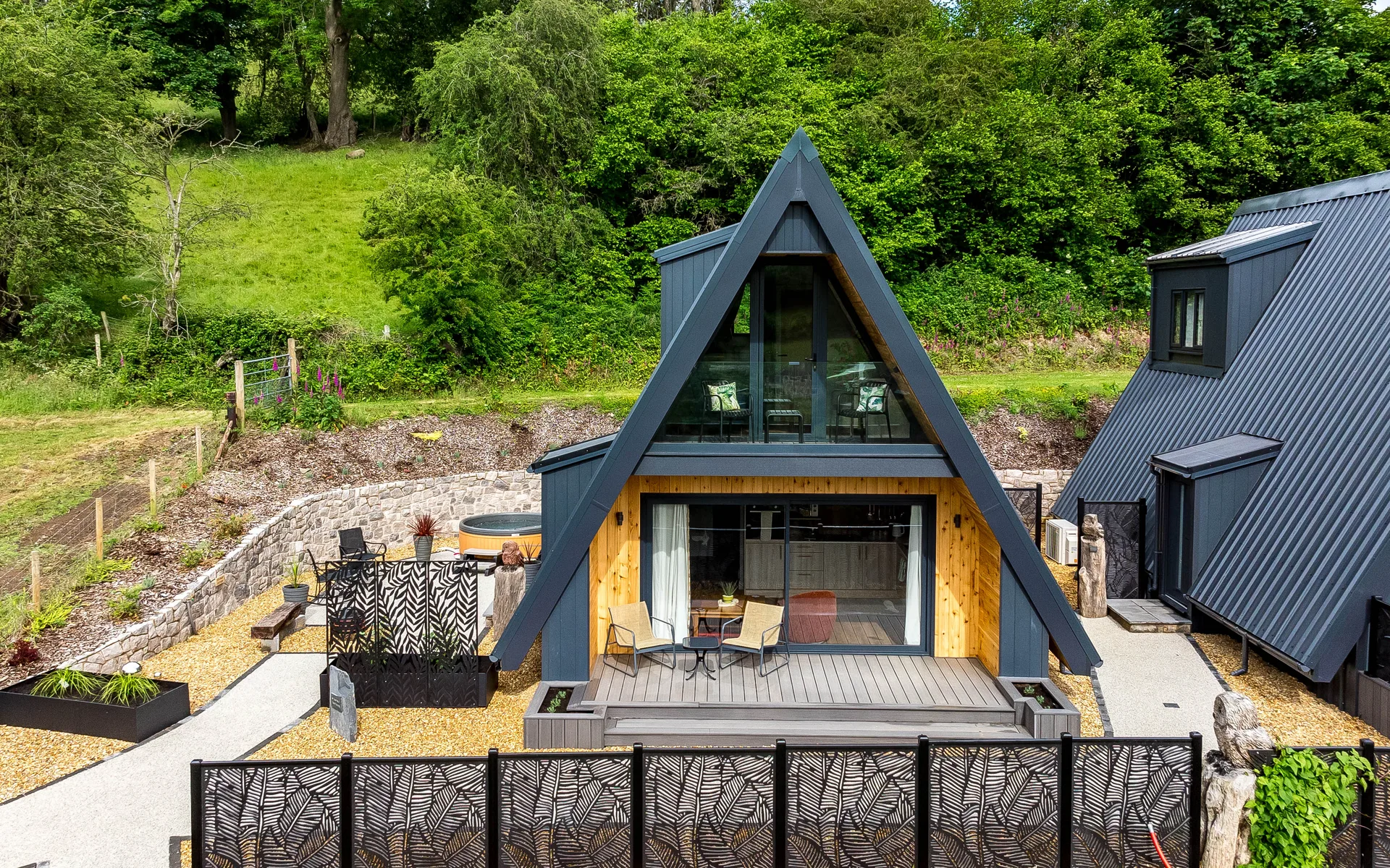 Completed A-frame lodge exterior, face-on view