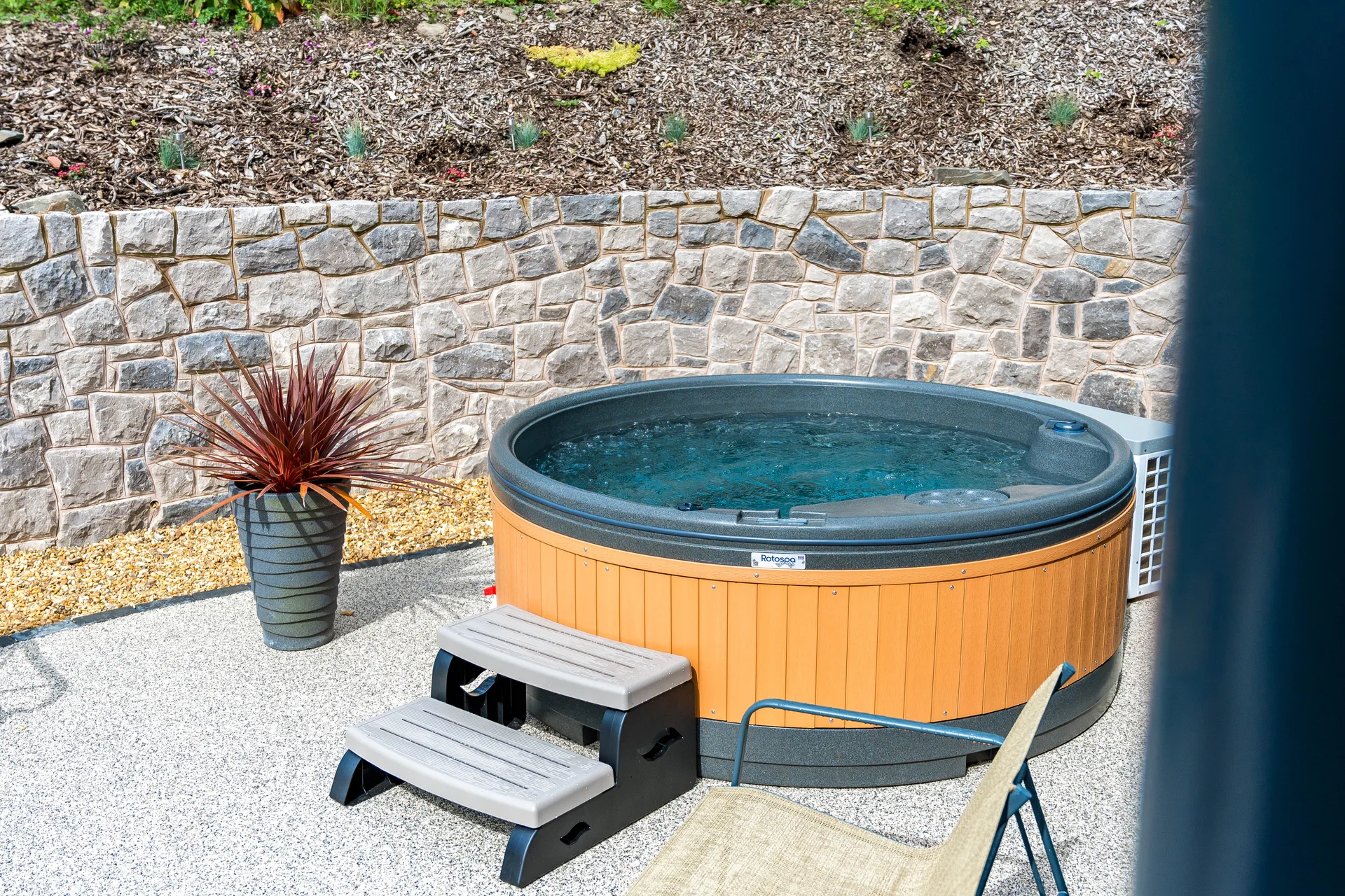 Hot tub and patio at a completed A-frame lodge