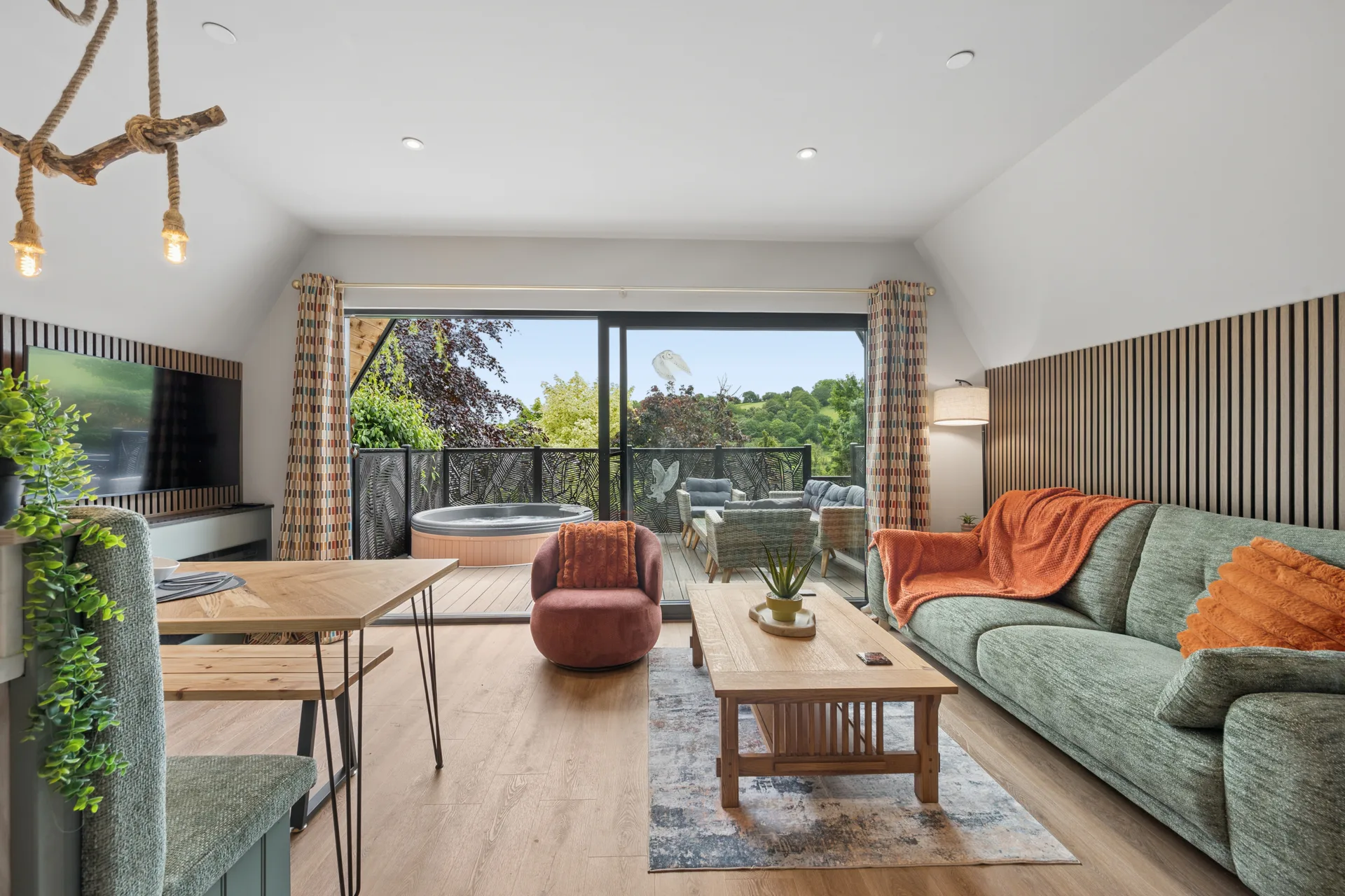 Panoramic views through the glazed gable end of an A-frame lodge